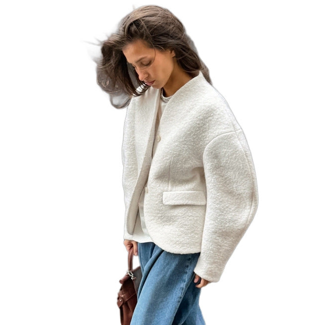 Ladies short jacket in boucle style with oversized sleeves and flap pockets