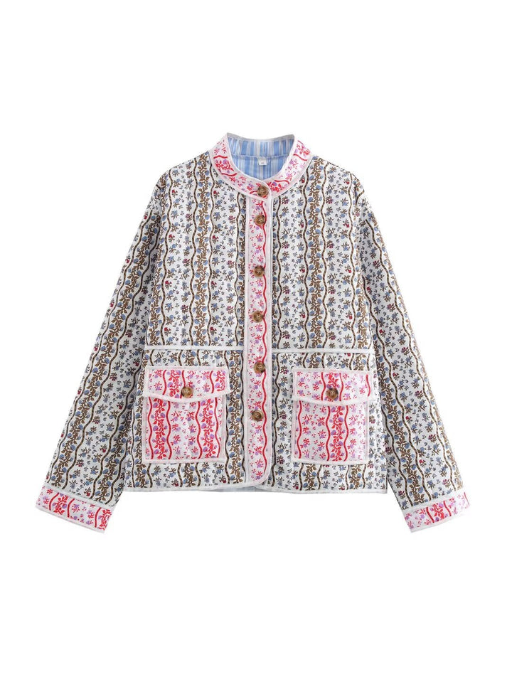 Ladies quilted short jacket with stand-up collar, patch pockets and fine ethnic print