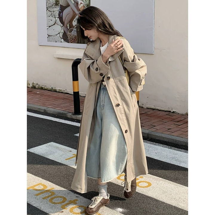 Women’s longer lighter trench coat in oversized style with straight cut and concealed button placket