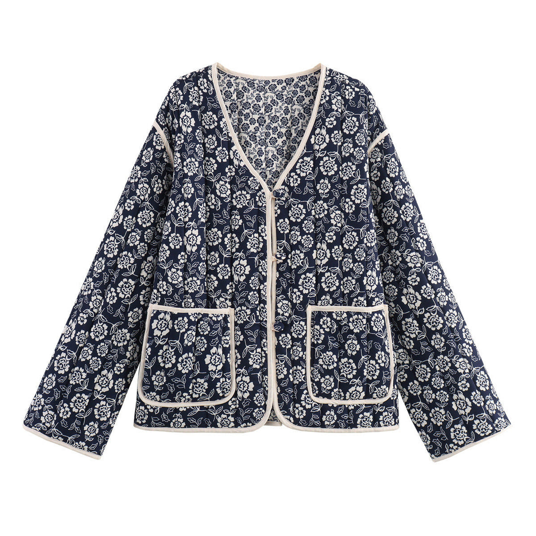 Ladies quilted jacket with floral allover, V-neck, contrast piping and patch pockets