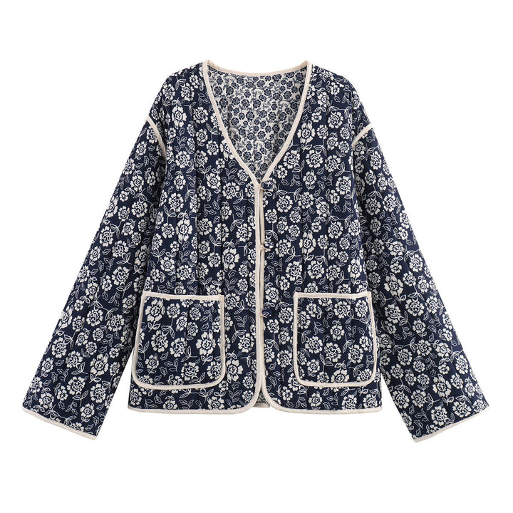 Ladies quilted jacket with floral allover, V-neck, contrast piping and patch pockets