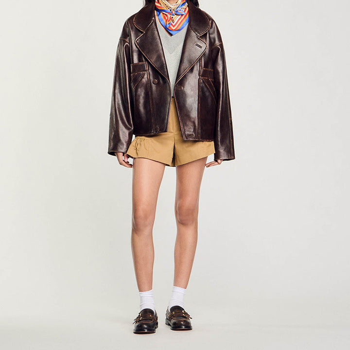 Women Short Cut Oversized Leather Jacket with Round Collar and Flap Pockets