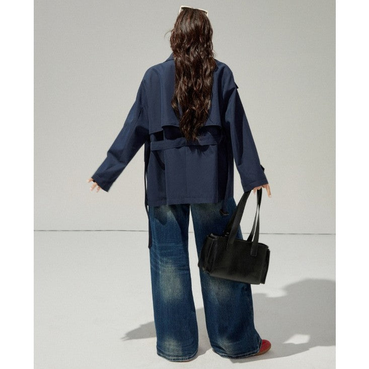 Ladies short trench coat with a flattering belt and double-breasted button placket
