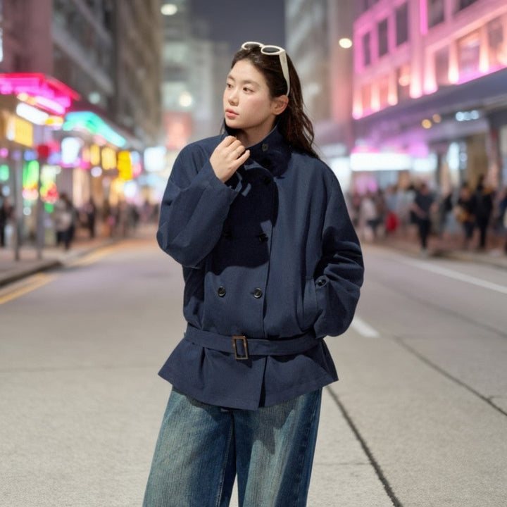 Ladies short trench coat with a flattering belt and double-breasted button placket