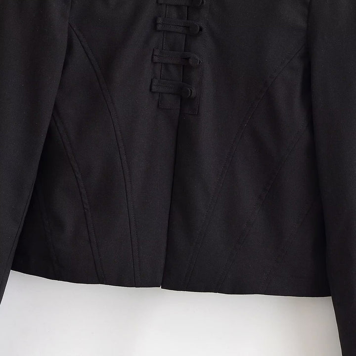 Women short fitted jacket with stand-up collar and decorative loop tape
