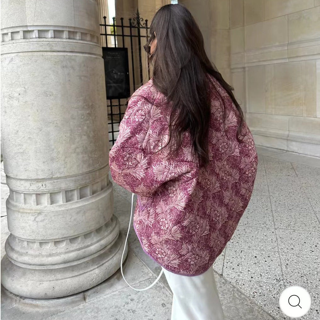Ladies short-cut quilted jacket in vintage floral pattern with shawl collar and contrasting piping
