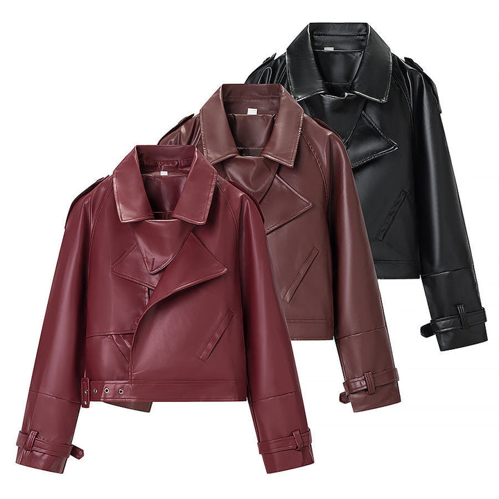 Women short cut biker jacket in leather look with asymmetrical lapel and waist belt