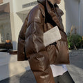 Women's short quilted faux leather puffer jacket with hood
