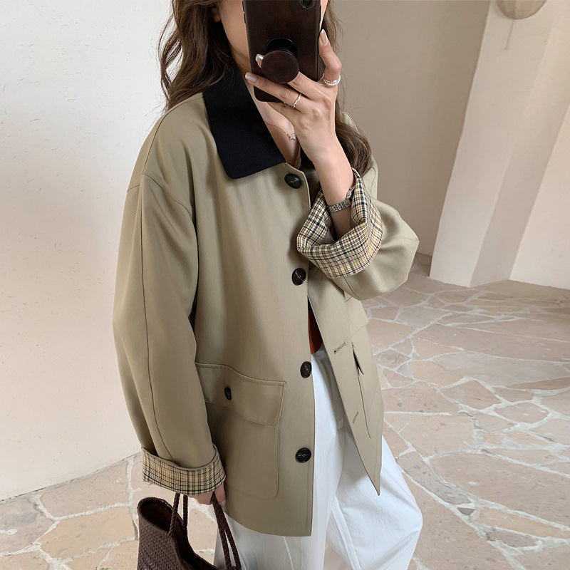 Women loosely fitted transitional jacket with contrasting collar and checked sleeve cuffs