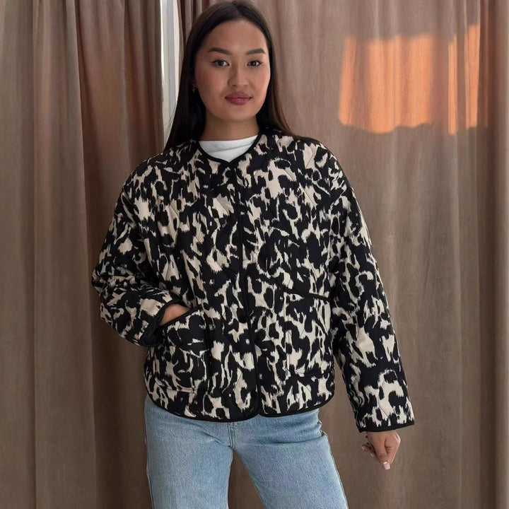 Women’s quilted jacket in oversized boxy cut with round neckline and abstract animal print