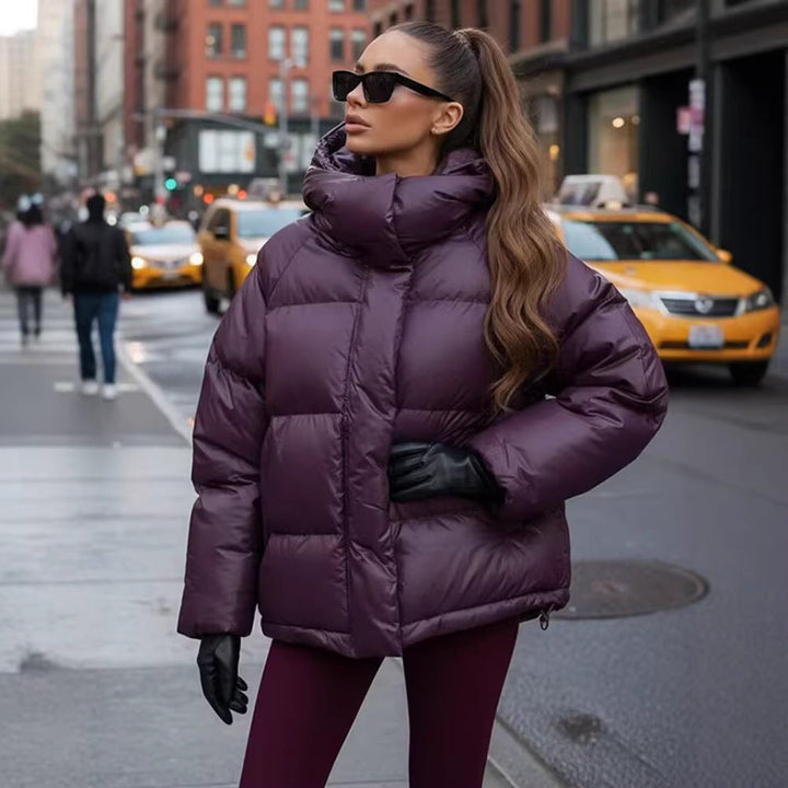 Ladies short padded oversized quilted jacket with high standing collar and hood