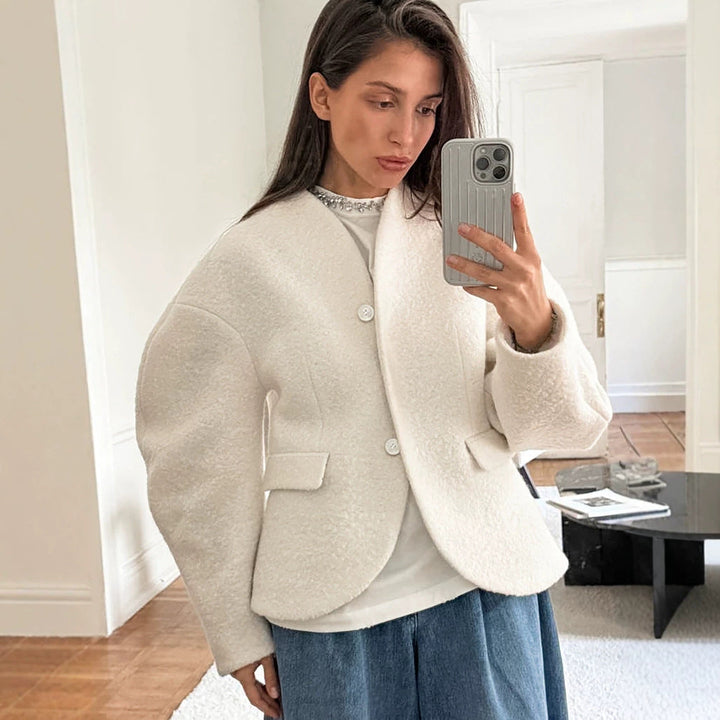Ladies short jacket in boucle style with oversized sleeves and flap pockets