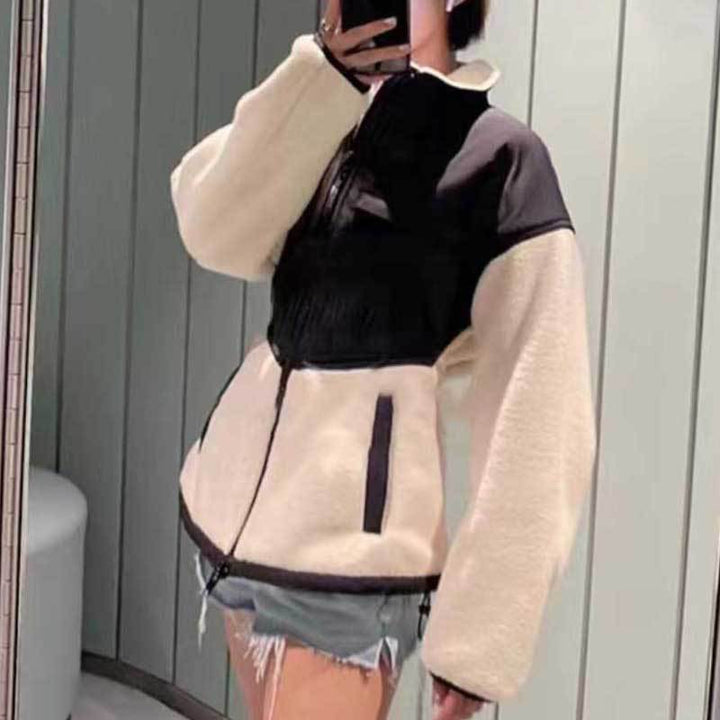 Ladies hybrid fleece jacket with padded top, stand-up collar and tailored peplum