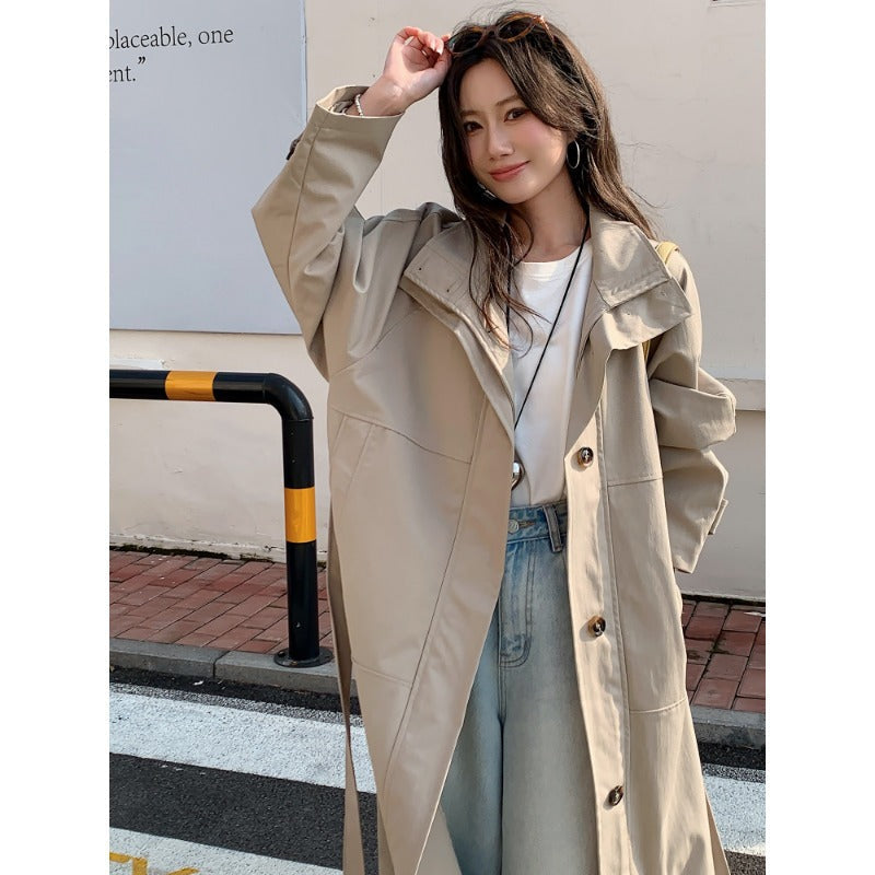 Women’s longer lighter trench coat in oversized style with straight cut and concealed button placket