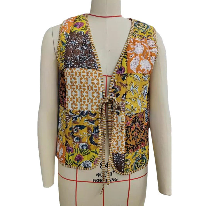 Ladies patchwork vest with tie belt, striped interior finish and contrast piping