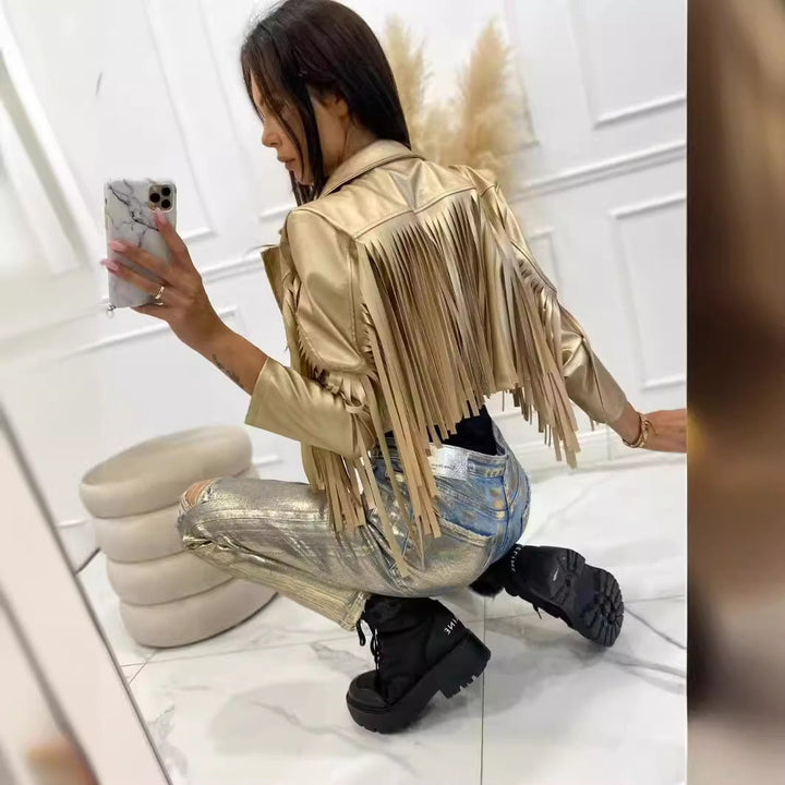 Women’s short jacket in biker style with metallic look and long leather fringes
