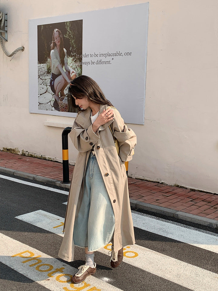 Women’s longer lighter trench coat in oversized style with straight cut and concealed button placket