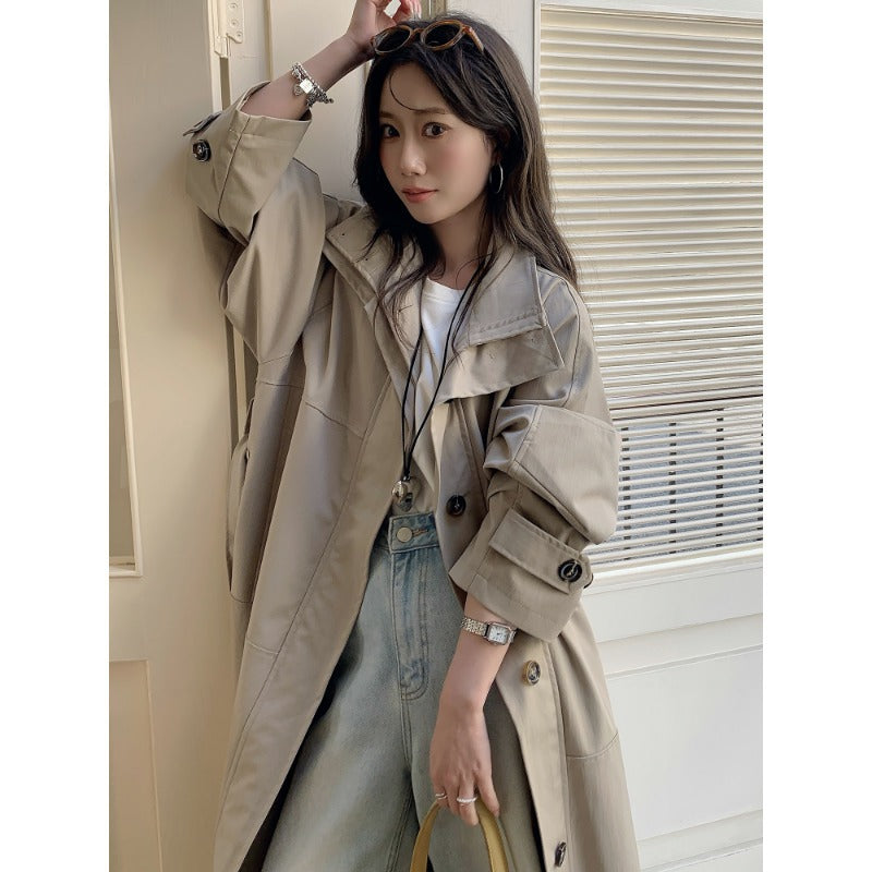 Women’s longer lighter trench coat in oversized style with straight cut and concealed button placket