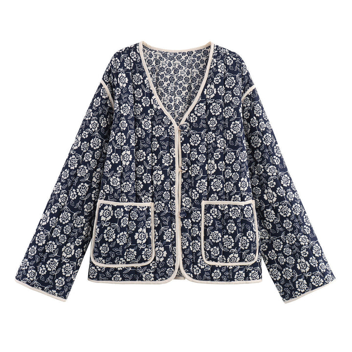 Ladies quilted jacket with floral allover, V-neck, contrast piping and patch pockets