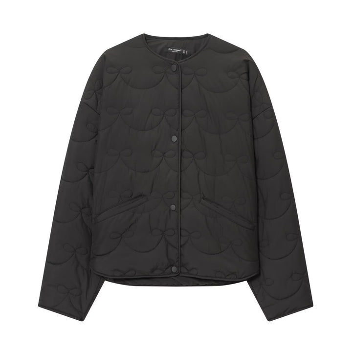 Women’s quilted jacket without collar with decorative bow quilting and snap button closure