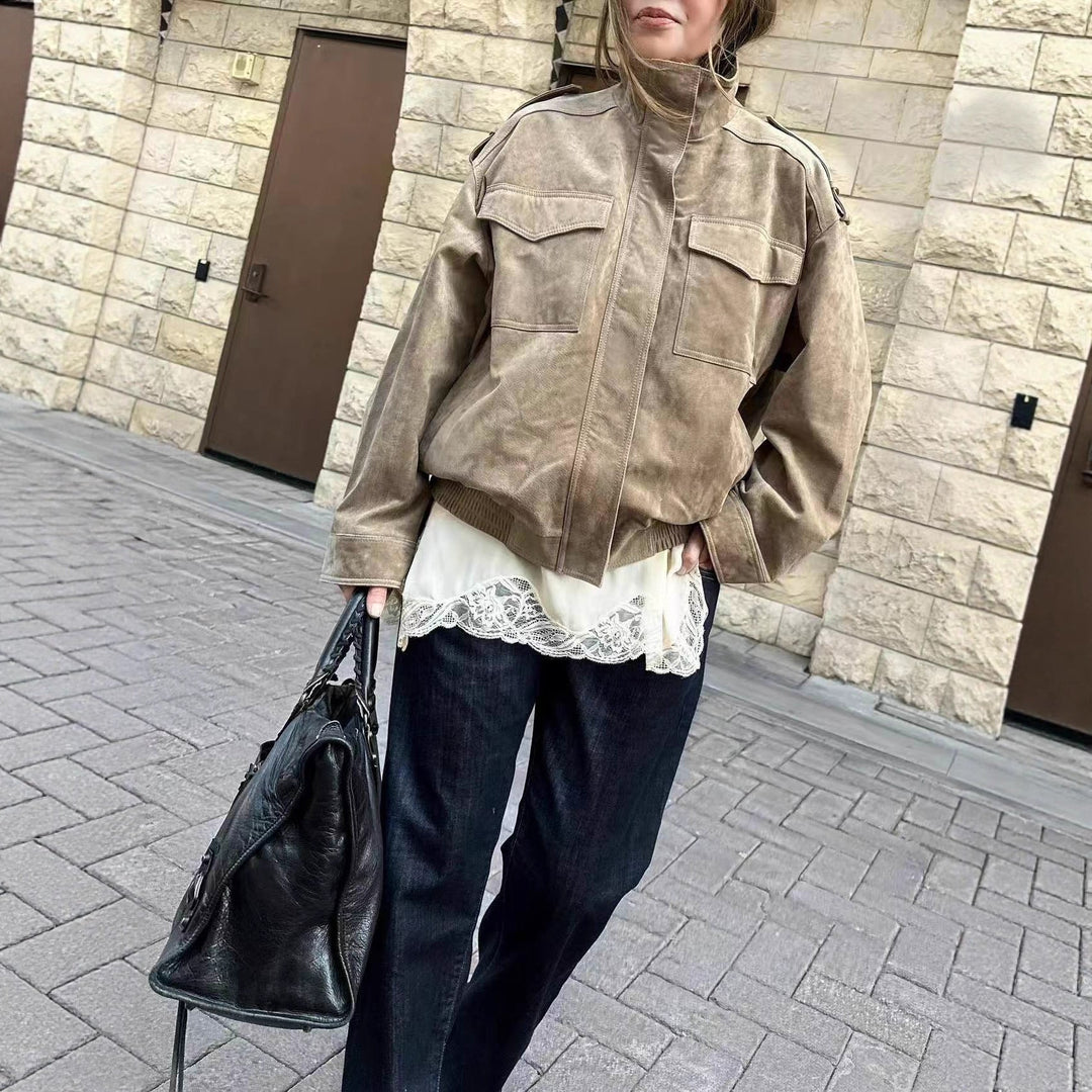 Women’s short jacket in military style with epaulets, patch chest pockets, and elastic hem