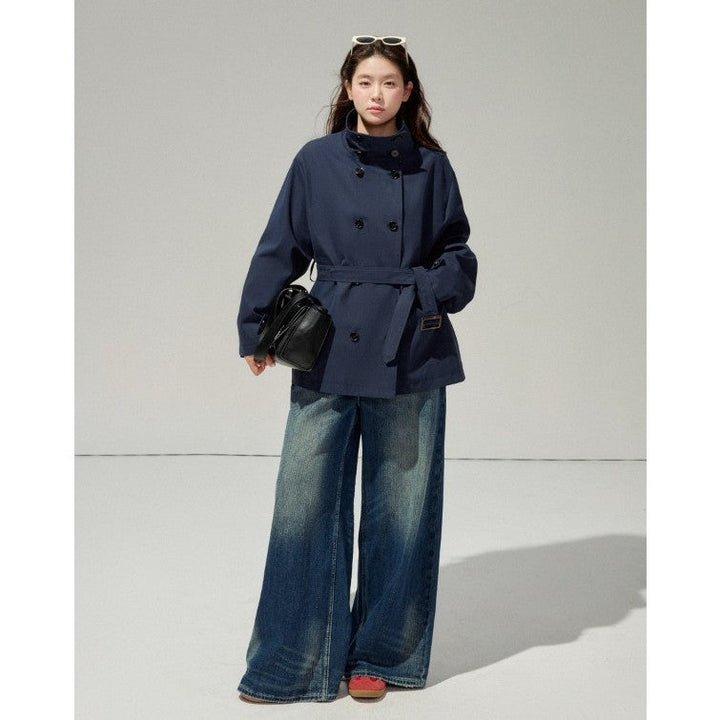 Ladies short trench coat with a flattering belt and double-breasted button placket