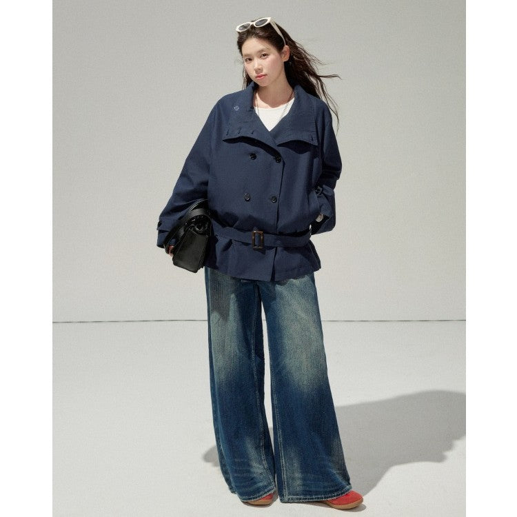 Ladies short trench coat with a flattering belt and double-breasted button placket