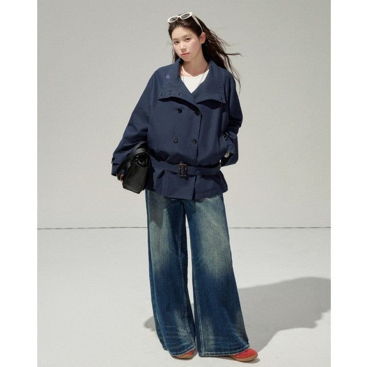 Ladies short trench coat with a flattering belt and double-breasted button placket