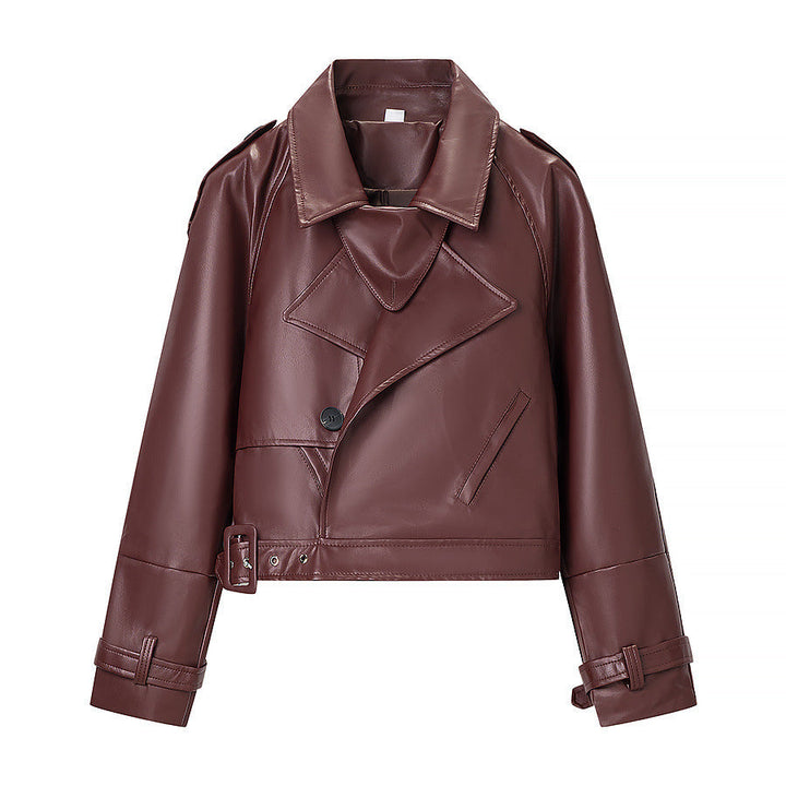 Women short cut biker jacket in leather look with asymmetrical lapel and waist belt