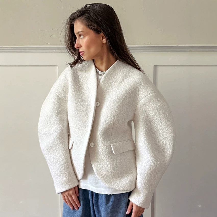 Ladies short jacket in boucle style with oversized sleeves and flap pockets