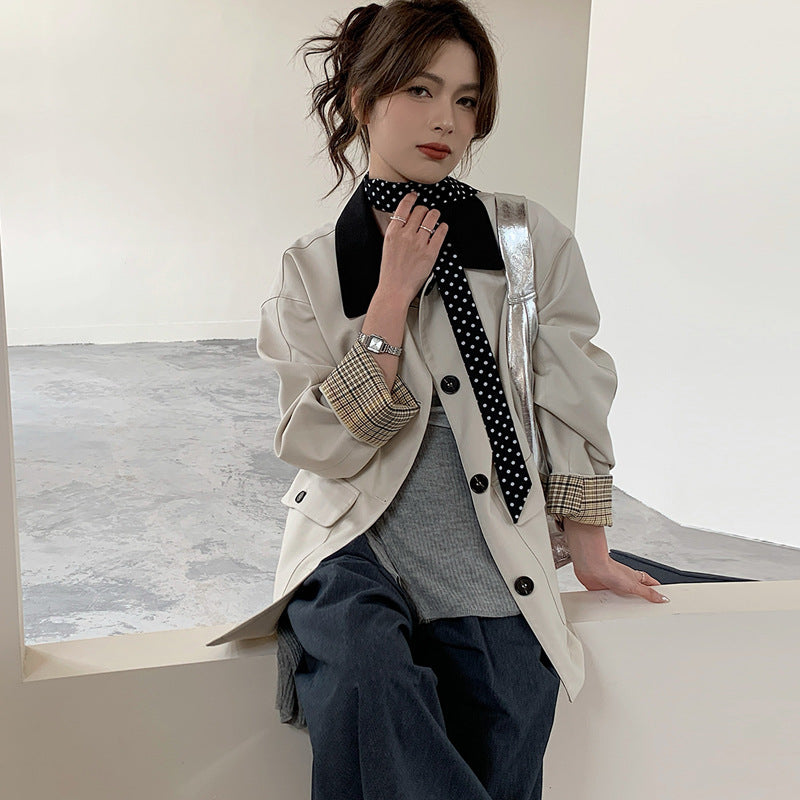 Women loosely fitted transitional jacket with contrasting collar and checked sleeve cuffs