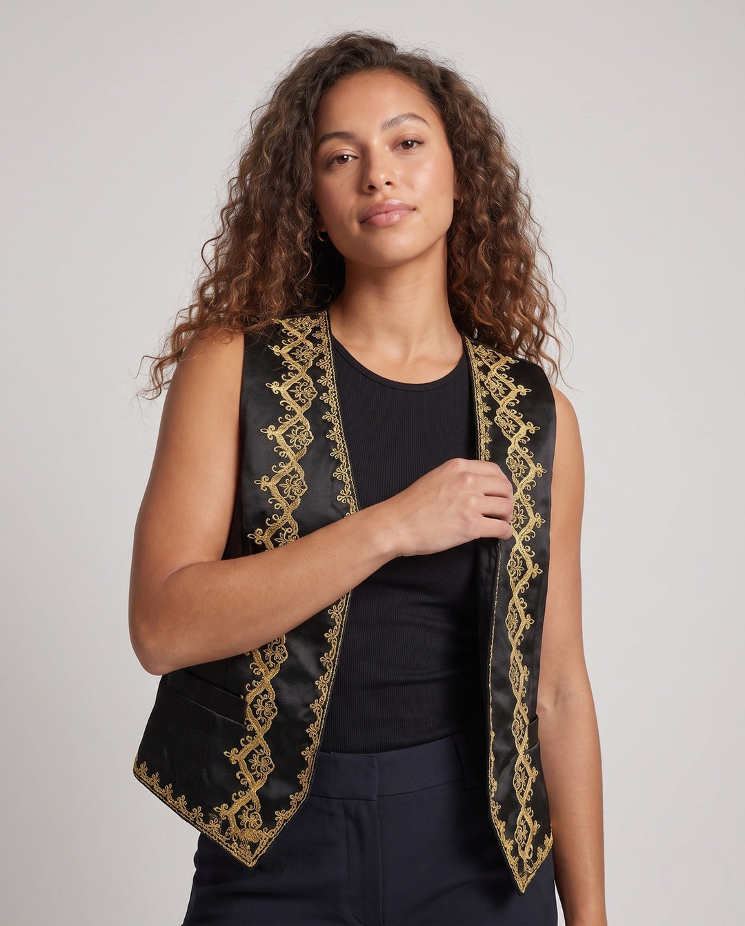 Ladies elegant vest with intricate golden embellishments