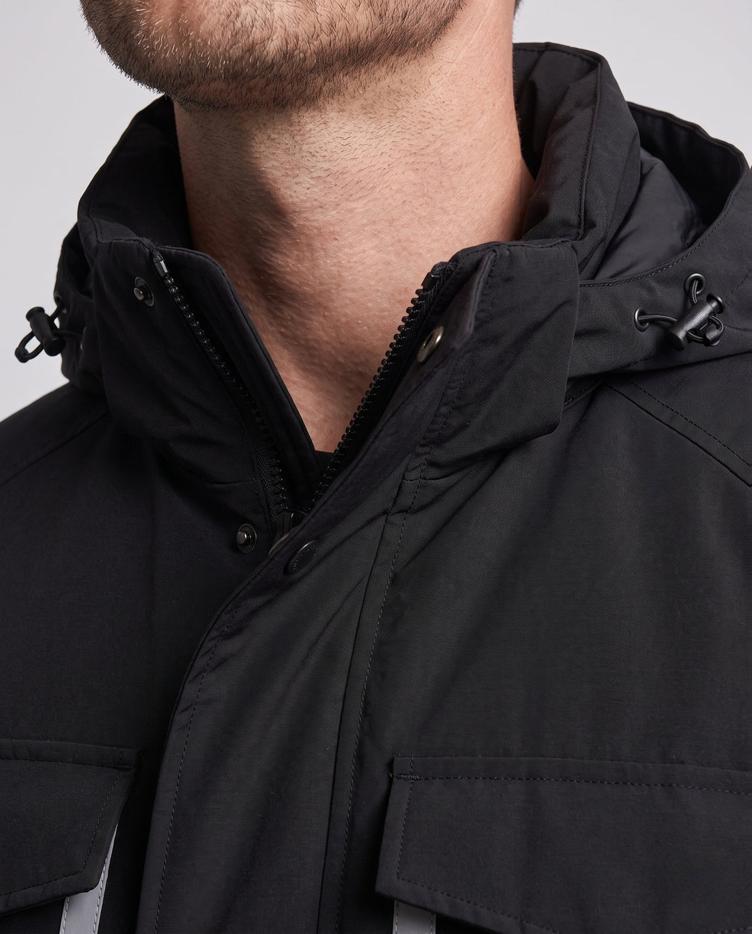 Unisex winter parka with reflective inserts and removable hood