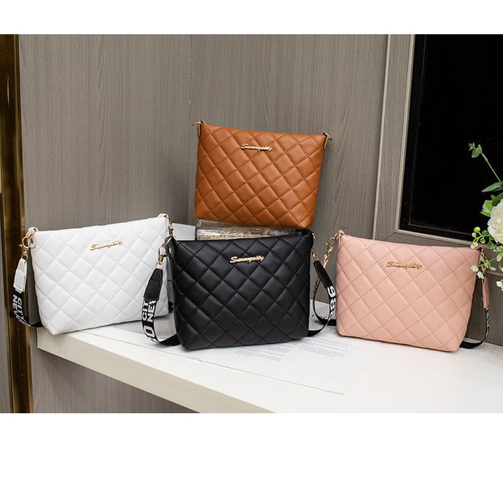 Black quilted crossbody bag with wide strap
