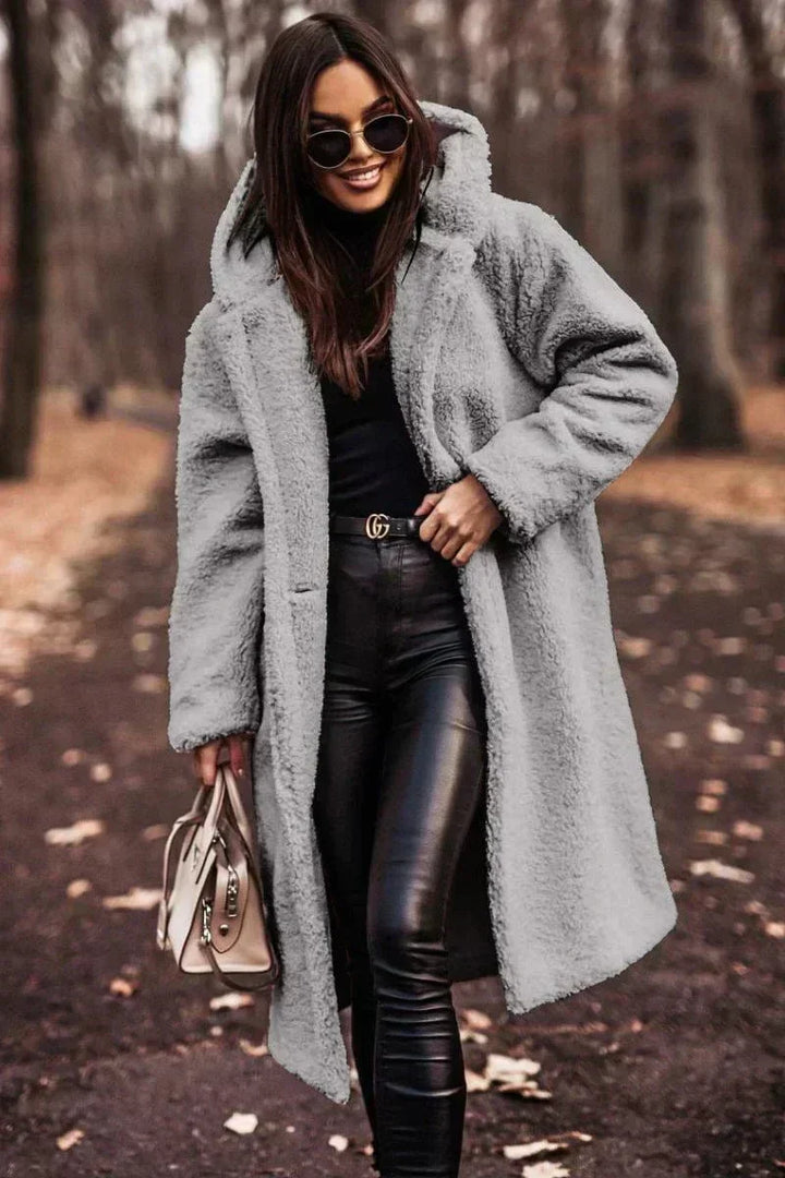 Long coat with elegant faux fur warmth and Timeless style